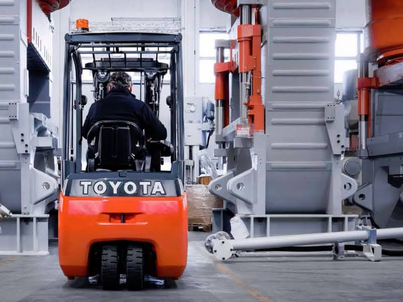 Forklift truck operating inside warehouse at Castle Eden Lift Trucks facility.