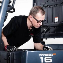Forklift technician inspecting a TRIOG CB forklift truck at Castle Eden Lift Trucks.